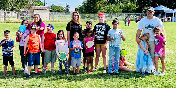 Carousel Child Care center kids with disc golf discs